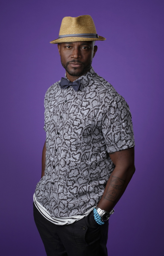 FILE - Actor and author Taye Diggs poses for a portrait during the 2018 Television Critics Association Summer Press Tour, on Aug. 6, 2018, in Beverly Hills, Calif. Diggs is the author of "Why" a children's book illustrated by Shane W. Evans.
