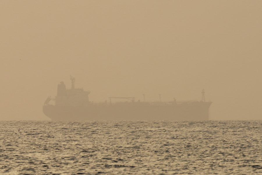 FILE - An oil tanker is moored off Fujairah, United Arab Emirates, Wednesday, Aug. 4, 2021. Technology to hide a ship's location previously available only to the world's militaries is spreading fast through the global maritime industry as governments from Iran to Venezuela -- and the rogue shipping companies they depend on to move their petroleum products -- look for stealthier ways to circumvent U.S. sanctions.