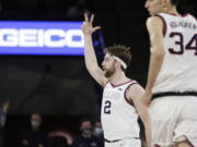 Gonzaga forward Drew Timme (2) celebrates his 3-point basket during the first half of the team's NCAA college basketball game against Santa Clara, Saturday, Feb. 19, 2022, in Spokane, Wash.