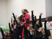 The Camas gymnastics team receive the second-place team trophy at the 4A state gymnastics meet at Sammamish High School in Bellevue on Saturday, Feb. 26, 2022.