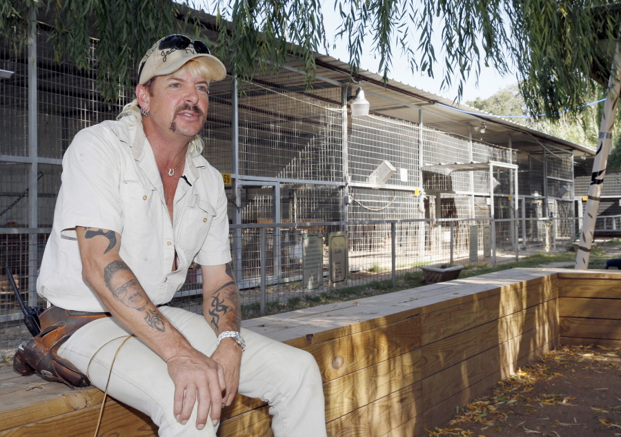 FILE - In this Aug. 28, 2013, file photo, Joseph Maldonado answers a question during an interview at the zoo he runs in Wynnewood, Okla. Maldonado known also as "Tiger King" Joe Exotic is headed to a federal courtroom Friday, Jan. 28, 2022, for a resentencing hearing. He's now in federal prison after a jury convicted him in a murder-for-hire plot involving his chief rival, Carole Baskin.