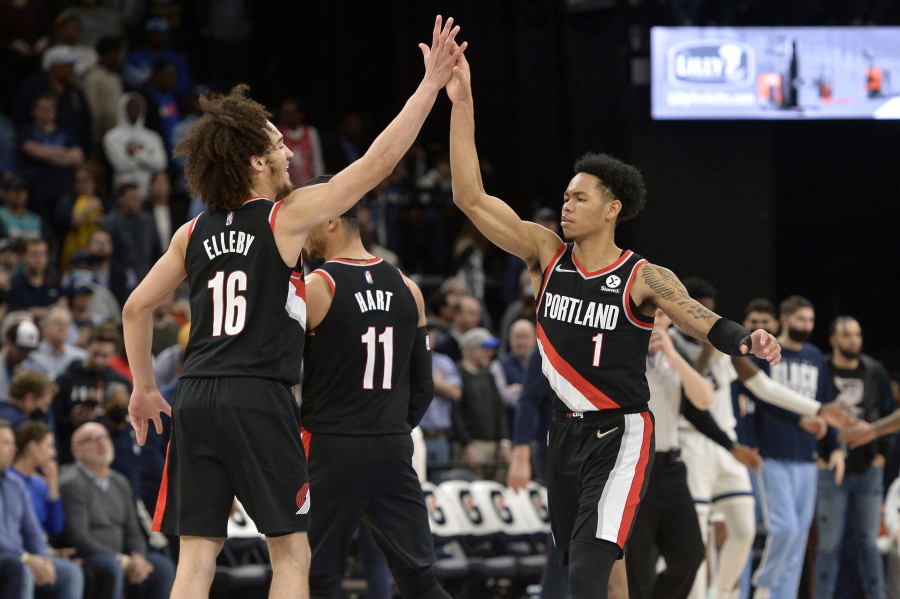 Portland Trail Blazers guards CJ Elleby (16) and Anfernee Simons (1) high five in the second half of an NBA basketball game against the Memphis Grizzlies Wednesday, Feb. 16, 2022, in Memphis, Tenn.