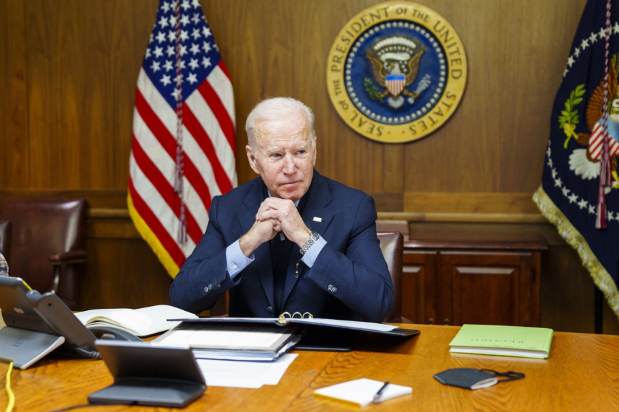 This image provided by The White House via Twitter shows President Joe Biden at Camp David, Md., Saturday, Feb. 12, 2022. Biden on Saturday again called on President Vladimir Putin to pull back more than 100,000 Russian troops massed near Ukraine's borders and warned that the U.S. and its allies would "respond decisively and impose swift and severe costs" if Russia invades, according to the White House.