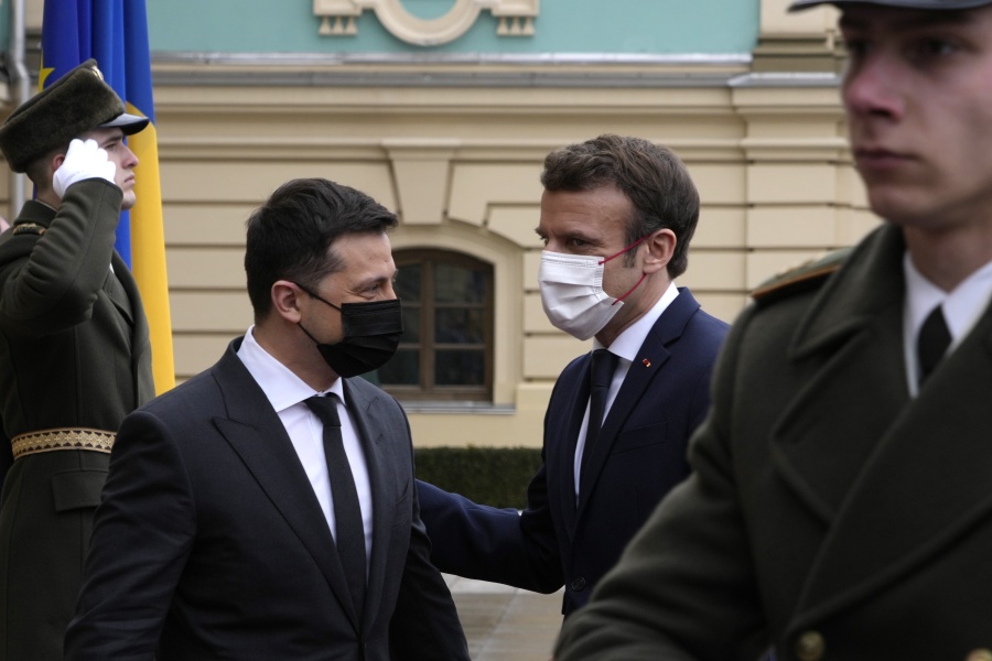French President Emmanuel Macron, right, is welcomed by Ukrainian President Volodymyr Zelenskyy before their talks Tuesday, Feb. 8, 2022 in Kyiv, Ukraine. Diplomatic efforts to defuse the tensions around Ukraine continued on Tuesday with French President Emmanuel Macron in Kyiv the day after hours of talks with the Russian leader in Moscow yielded no apparent breakthroughs.