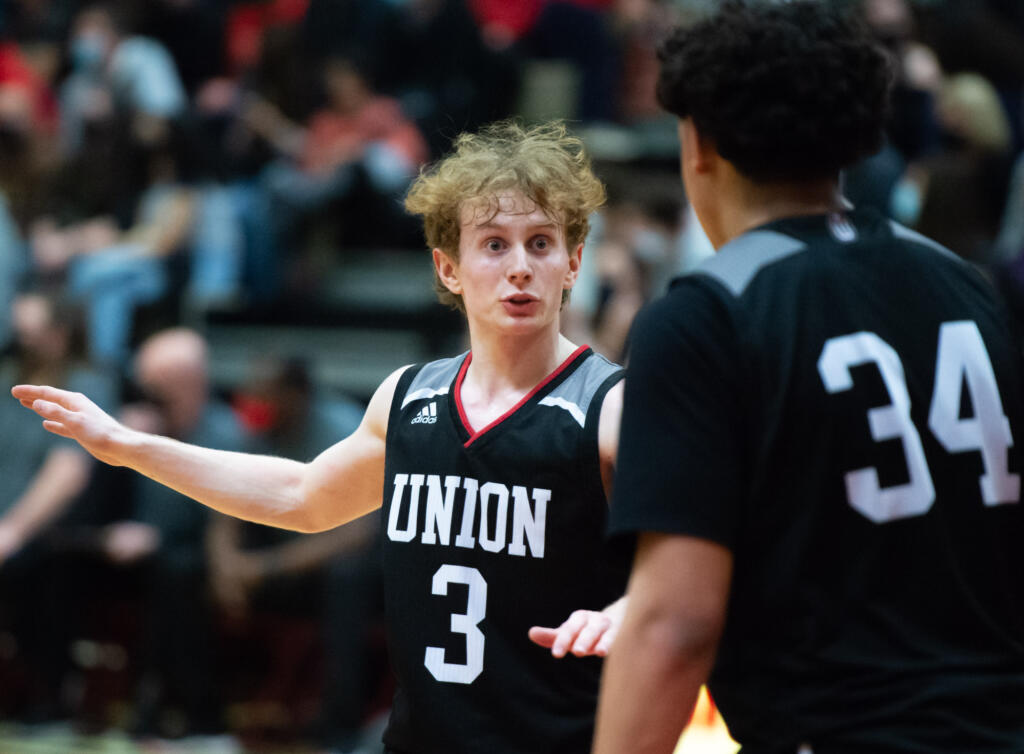 Union's Bryson Metz gives instruction to teammate Yanni Fassilis in a 4A Greater St. Helens League boys basketball on Tuesday, Feb. 8, 2022, at Camas High School. Camas won 80-77.