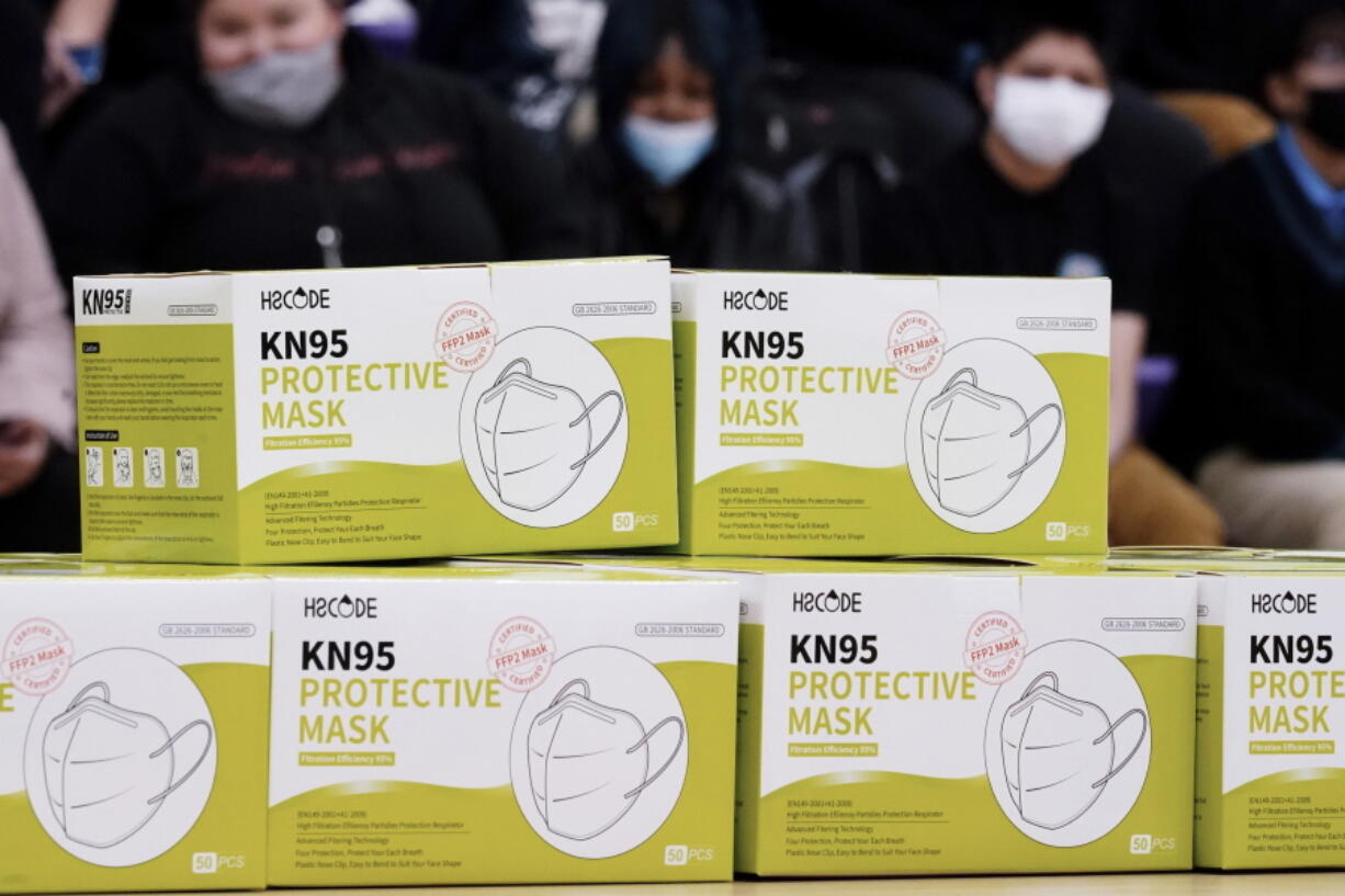 Shown are KN95 protective masks before being distributed to students at Camden High School in Camden, N.J., Wednesday, Feb. 9, 2022. As the omicron wave of the coronavirus subsides, several U.S. states including New York and Illinois ended mask mandates this week for indoor settings, while others lifted requirements at schools.