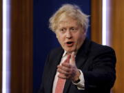 Britain's Prime Minister Boris Johnson speaks during a media briefing in Downing Street, London,  Monday Feb. 21, 2022, to outline the Government's new long-term COVID-19 plan.