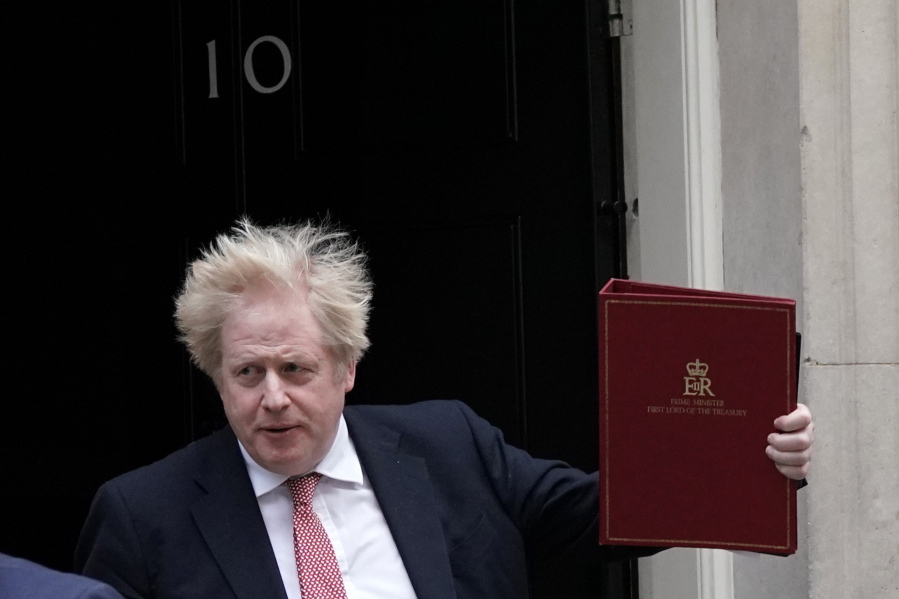 Britain's Prime Minister leaves 10 Downing Street, London, Monday Feb. 21, 2022, to head to the House of Commons.