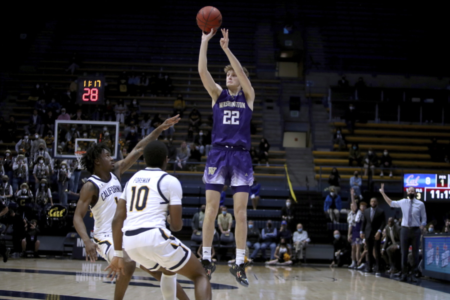 Washington guard Cole Bajema (22) shoots over California guard Joel Brown (1) and guard Makale Foreman (10) during the first half of an NCAA college basketball game Thursday, Feb. 3, 2022, in Berkeley, Calif.