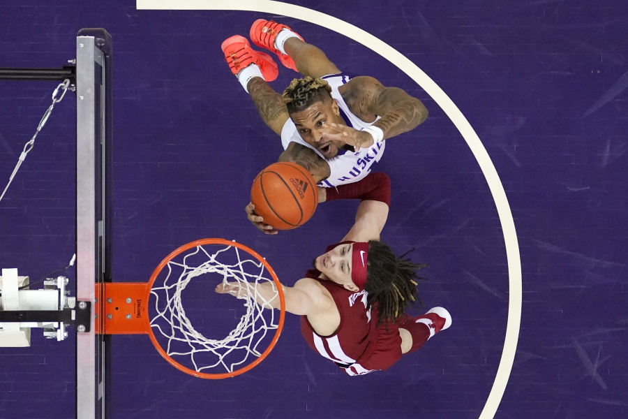 Washington's Nate Roberts, top, grabs a rebound next to Washington State's Tyrell Roberts during the first half of an NCAA college basketball game Saturday, Feb. 26, 2022, in Seattle.