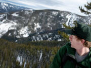 Ryan Matz, an avalanche forecaster with the U.S. Forest Service, looks out over the forest Feb. 7 near Mullan, Idaho. Matz is the Panhandle Forests first full-time avalanche forecaster.