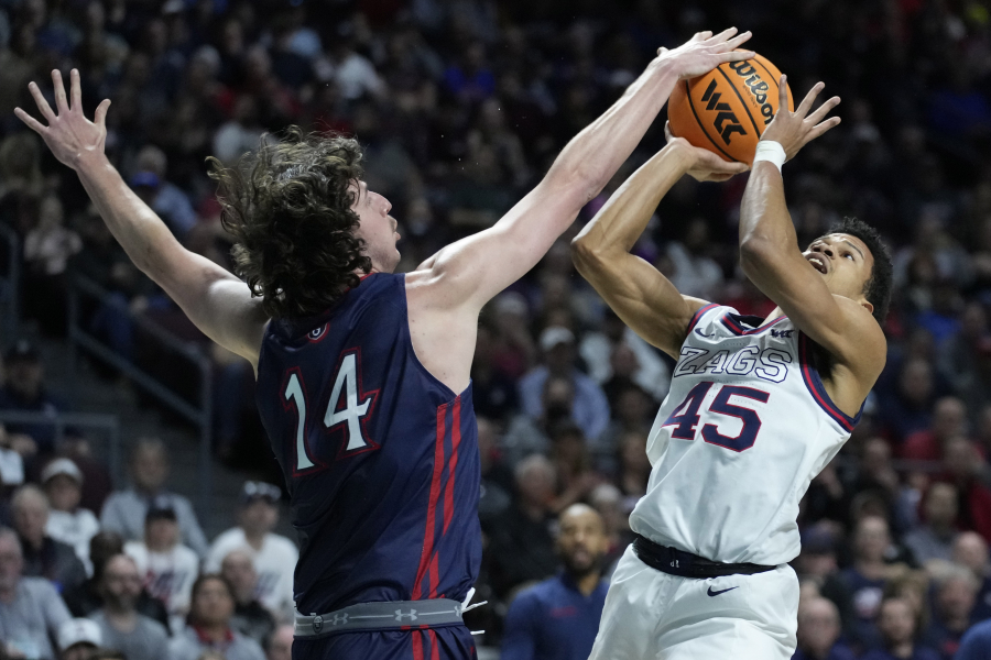 Gonzaga's Rasir Bolton (45) shoots over Saint Mary's Kyle Bowen (14) during the first half of an NCAA college basketball championship game at the West Coast Conference tournament Tuesday, March 8, 2022, in Las Vegas.