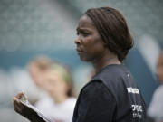 Tina Ellertson coaches during a Thorns Youth Academy at Providence Park on Tuesday July 22, 2014.