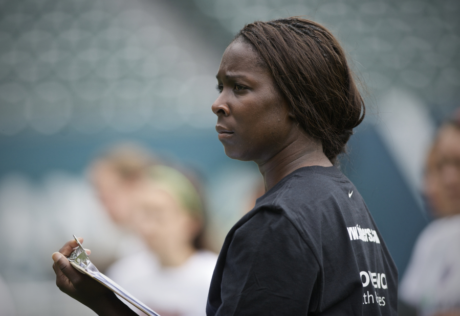 Tina Ellertson coaches during a Thorns Youth Academy at Providence Park on Tuesday July 22, 2014.