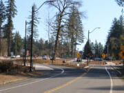 Kelly Moyer/Post-Record files 
 Drivers flow through a newly constructed traffic roundabout at Northeast Everett Street and Lake Road in Camas on March 9, 2021.