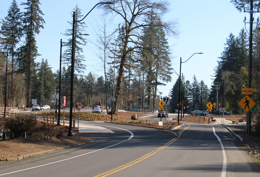 Kelly Moyer/Post-Record files 
 Drivers flow through a newly constructed traffic roundabout at Northeast Everett Street and Lake Road in Camas on March 9, 2021.