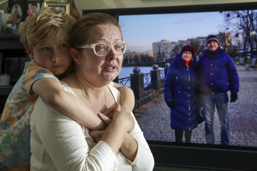 Ganna Hovey is comforted by her son, Leonardo, at their Huntington Beach home on March 5, 2022. Hovey???s parents, pictured beside her, have been sheltering in Kharkiv, Ukraine, during Russia???s invasion.