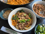 Made with a spicy sauce containing Sichuan chili oil and garlic, and topped with crispy round pork, Dan Dan Noodles are a popular street food in China.