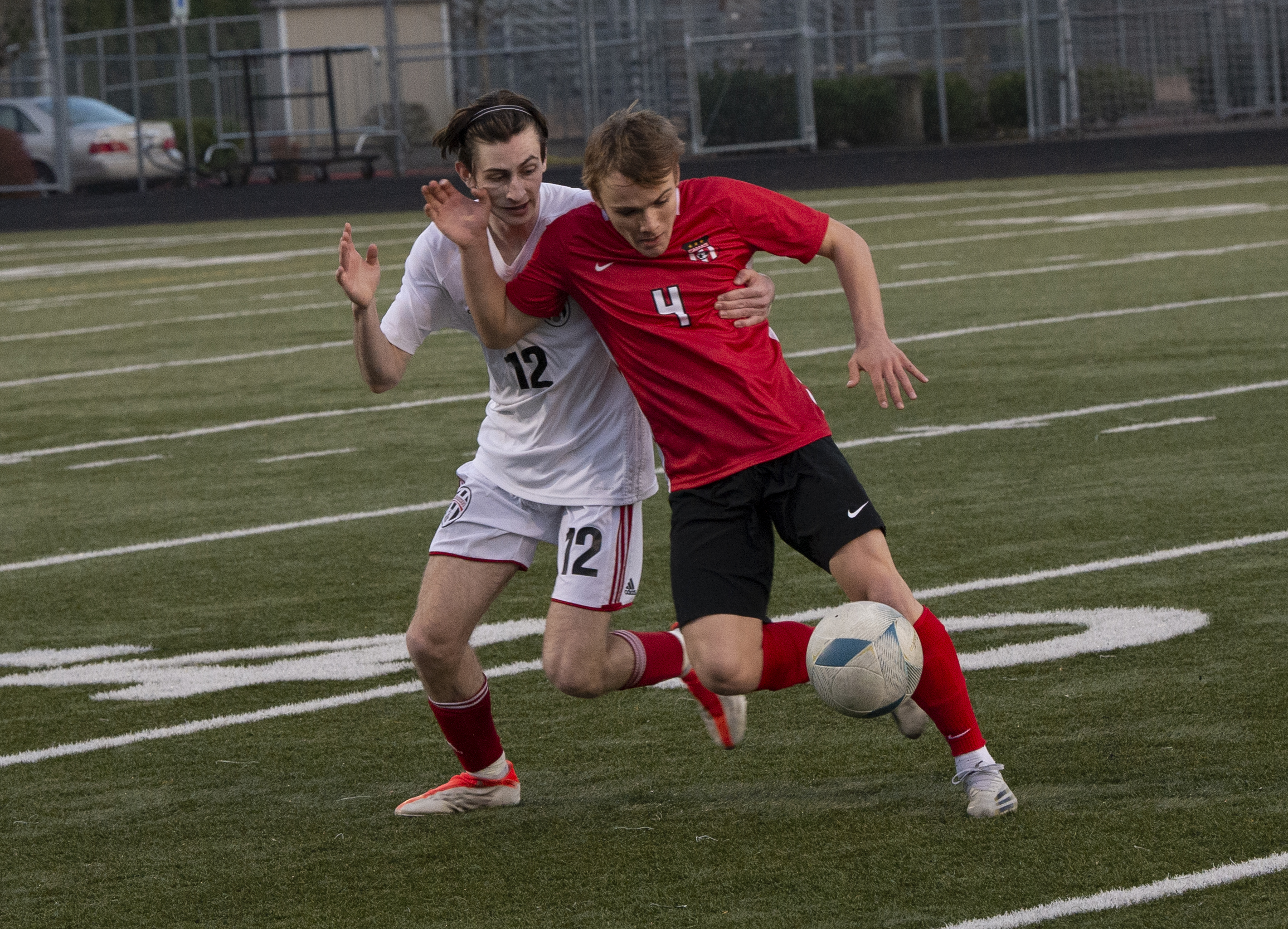 Union's Sam Wilson (12) and Camas' Kieran Halsinger (4) battle for possession of the ball during Union's 1-0 win over Camas on Thursday, March 22, 2022.
