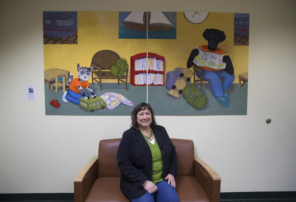Amy Russell, executive director of the Children's Justice Center, is pictured in the lobby of the downtown offices March 17, 2017.