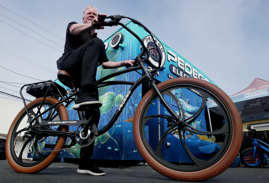 Tom Bock, the owner of Pedego Electric Bikes in Huntington Beach, California, hasn't yet raised bike prices, although his business is challenged by higher shipping, labor and other costs.