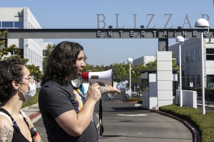 Several hundred Activision Blizzard employees stage a walkout outside the gate at Activision Blizzard headquarters on July 28, 2021, in Irvine, California. (Allen J.