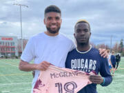 Portland Timbers player Zac McGraw poses with Seton Catholic senior David Moore after the Timbers player came out to Seton's practice Monday to talk to the team about race issues.