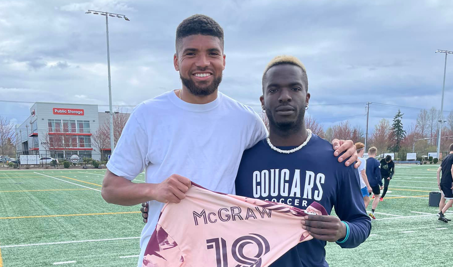 Portland Timbers player Zac McGraw poses with Seton Catholic senior David Moore after the Timbers player came out to Seton's practice Monday to talk to the team about race issues.