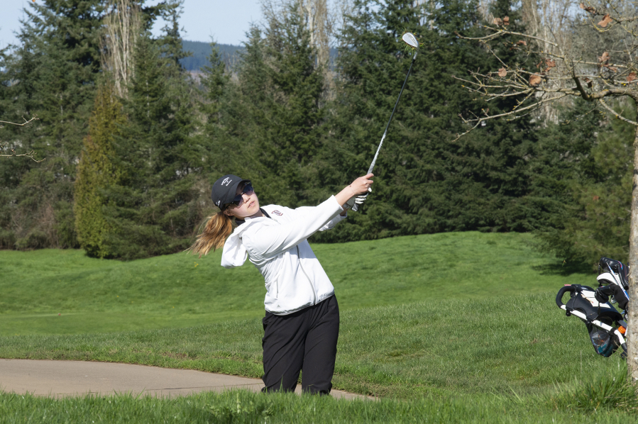 Union golfer Jade Gruher hits an approach shot onto the sixth green at Camas Meadows Golf Club on Thursday, March 24, 2022.