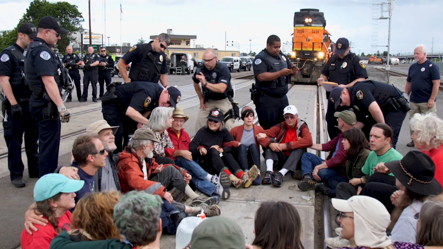 Activists at the Port of Vancouver get arrested in fall 2019 while blocking a train hauling equipment meant for the Trans Mountain Pipeline.