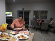 As the family sits down to a Sunday dinner in February, Maryam Azizpour serves her daughter, 6-year-old Murwarid, homemade chicken and qabili palau. That's the national dish of Afghanistan, made with rice, meat, carrots, raisins and spices. "Your country is like your mother, and you cannot forget your mother," Maryam said.
