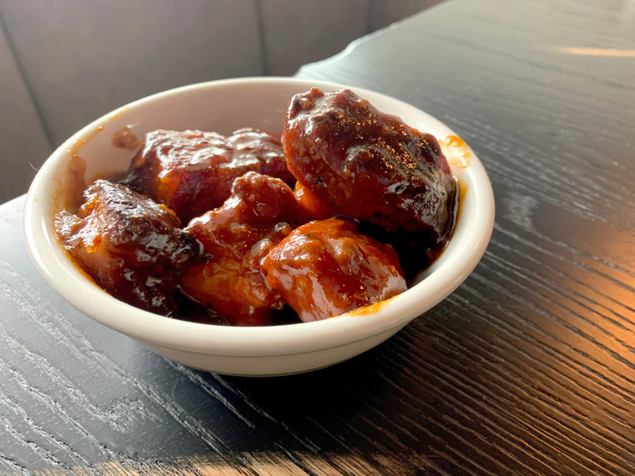 Magnolia Tavern smokes its pork belly burnt ends with cherry wood.