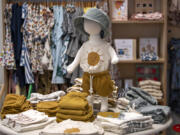 A display of summertime clothing for children is seen at Lyon & Pearle.