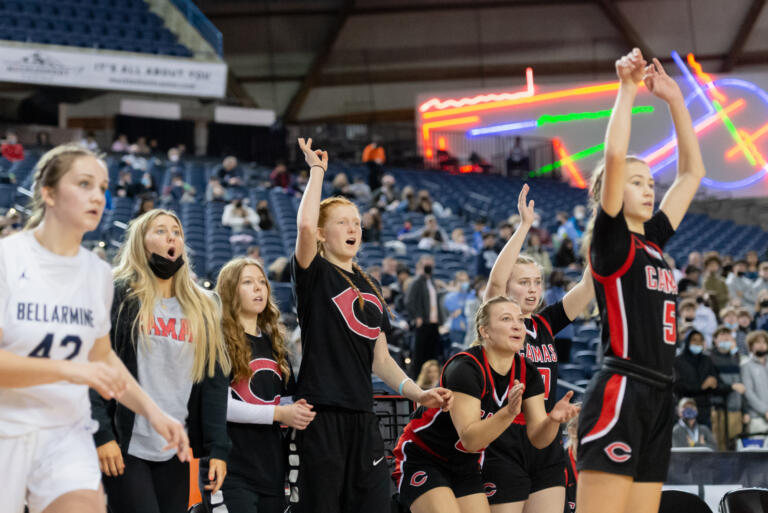 The Camas bench watches a Parker Mairs' 3-pointer fall in the 4A State Girls Basketball tournament on Wednesday, March 2, 2022, at the Tacoma Dome.