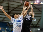 Union's Josiah Baldassare tries to shoot over a pair of Curtis defenders in a 4A State Boys Basketball semifinal on  Friday, March 4, 2022, at the Tacoma Dome.