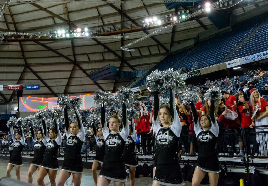 The Union cheerleaders shake their pom-poms during a free throw in a 4A State Boys Basketball semifinal on  Friday, March 4, 2022, at the Tacoma Dome.