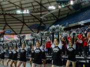 The Union cheerleaders shake their pom-poms during a free throw in a 4A State Boys Basketball semifinal on  Friday, March 4, 2022, at the Tacoma Dome.