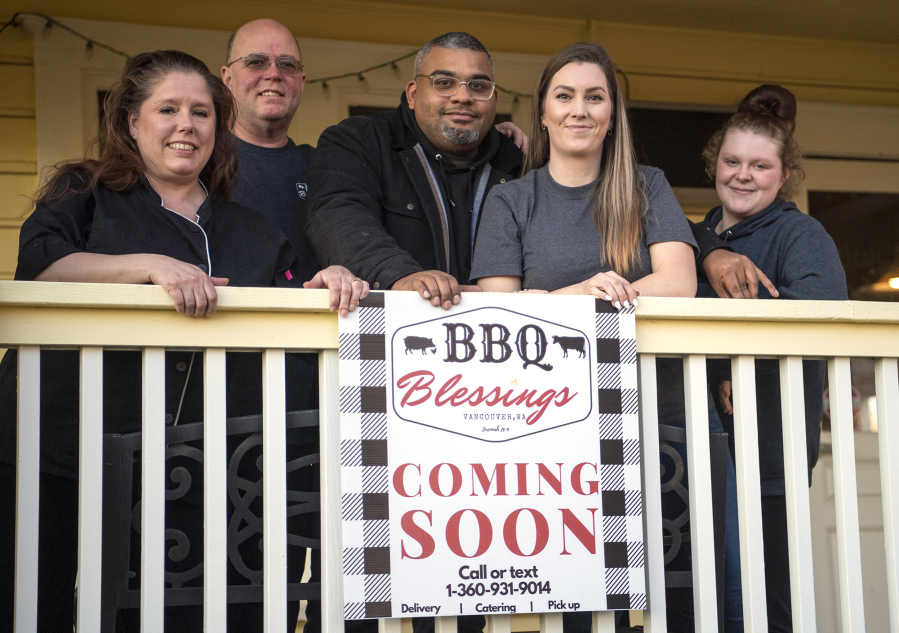 The BBQ Blessings staff stand on the front porch of their restaurant, which is set to open in April in the building that once housed Christine's Restaurant. Chef Judy Williams, from left, business partner Greg Williams, owners Kris and Jenny England, and manager Chyna Conner.