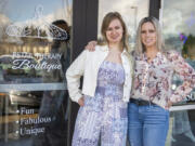 Mother-daughter duo and co-owners of Retail Therapy Boutique, Shanya Giese, right, and Hailey Giese, pose for a portrait outside their store in east Vancouver.