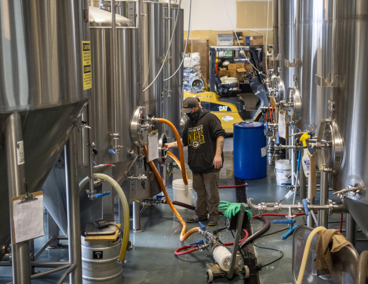 Brewer Josh McKinley works at 54-40 Brewing in Washougal. The brewery has been picked up for statewide distribution. At top, a K?lsch style Kascadia ale will be one of the 54-40 beers available for distribution statewide.