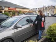 Driver Jennifer Heinlein of Vancouver would benefit from a proposed new law that would require ride-hail companies to pay benefits and minimum wage to contractors. Opponents say it will drive up the cost of rides.