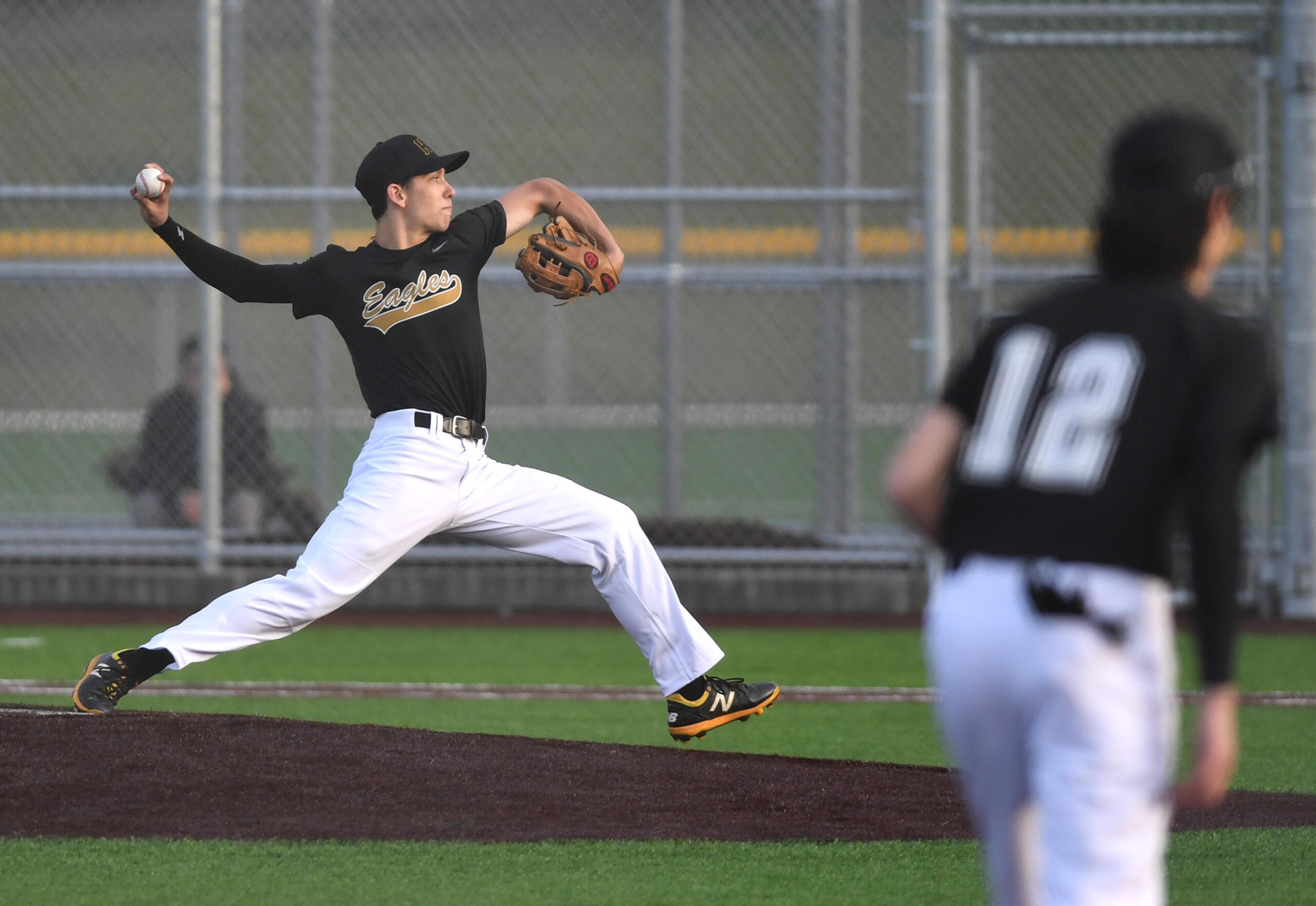 Hudson’s Bay pitcher Chanz Flores throws the ball Friday, March 11, 2022, during the Eagles’ 5-3 win against Evergreen at the Evergreen Sports Complex.