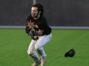 Hudson's Bay outfielder Dylan Damos makes a running catch during the Eagles's 5-3 win against Evergreen at the new Evergreen Sports Complex.