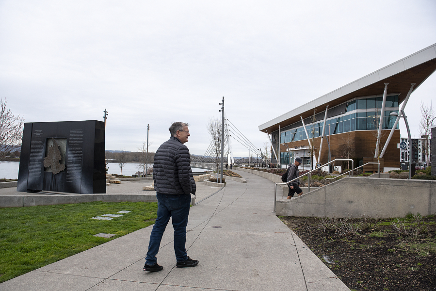 Schuyler Hoss, who retired recently after working in state government, enjoys a walk at The Waterfront Vancouver on Monday morning.
