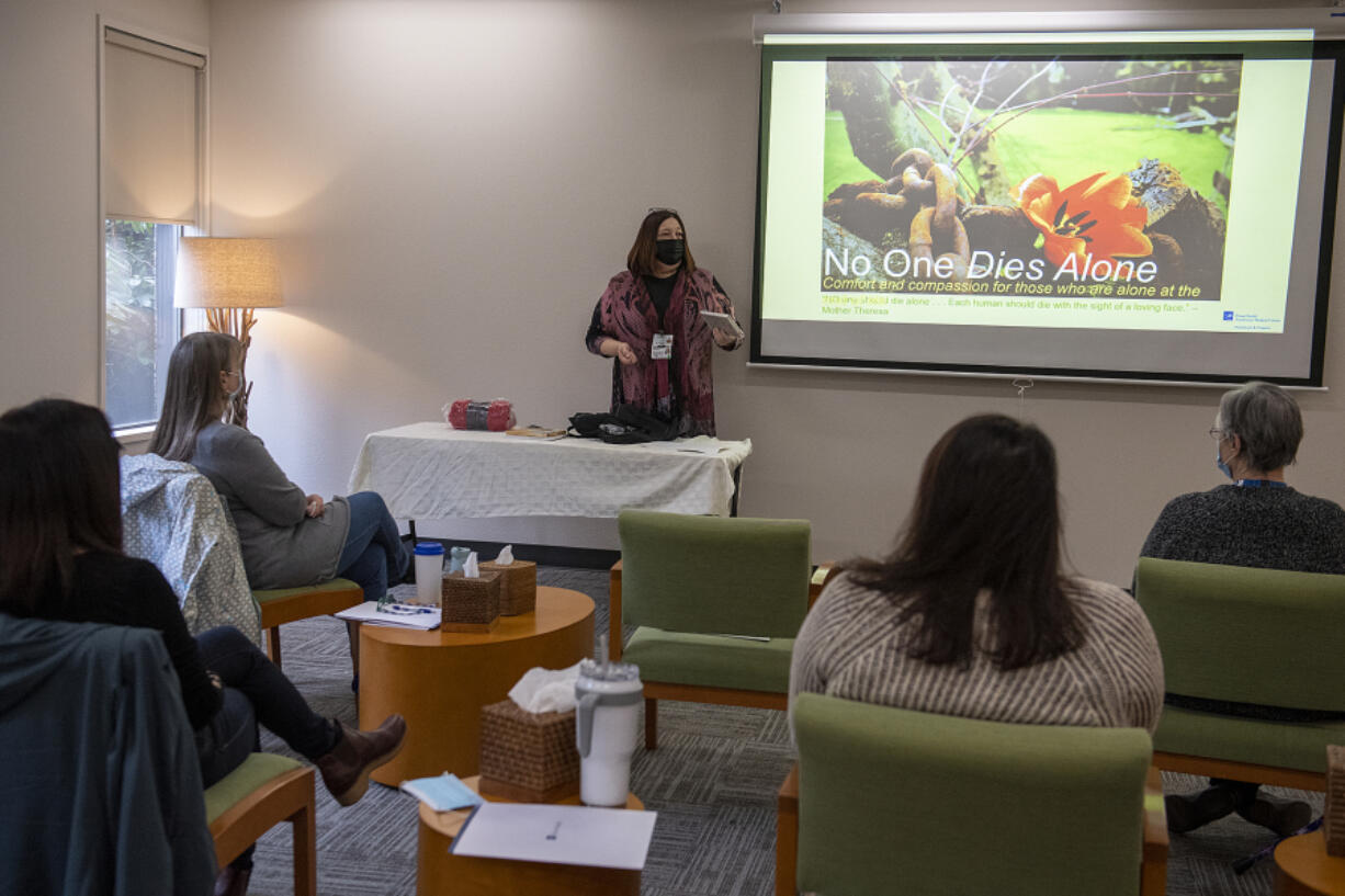 Colleen Storey of the No One Dies Alone program speaks to volunteers during a training session at Hope Bereavement Services on Monday morning.  The purpose of the program is to provide a reassuring presence at the bedside of a dying individual who would otherwise be alone.