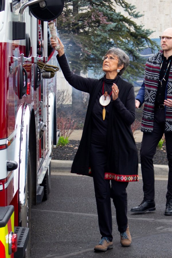 Spiritual Leader Tanna Engdahl blesses the fire engine gifted by the Cowlitz Indian Tribe to Clark-Cowlitz Fire Rescue at a ceremony marking the gift on Friday at ilani.