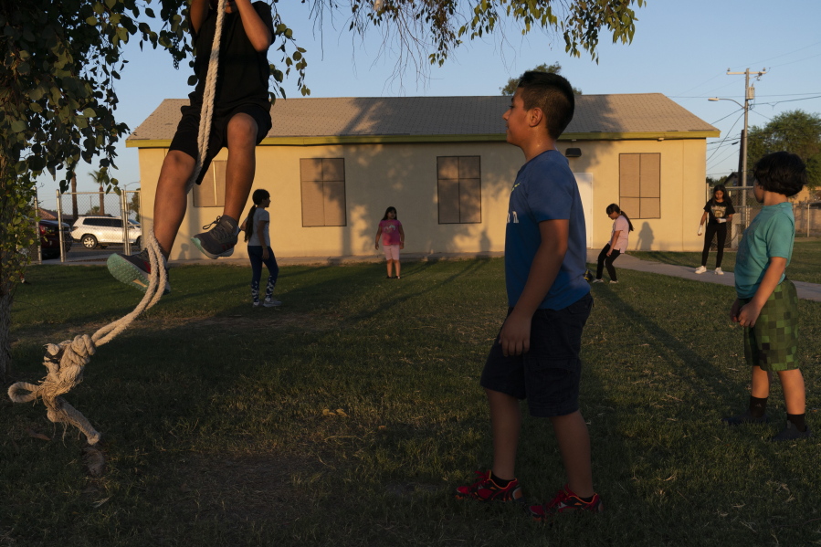 FILE - Children play in the yard of a community boxing club Thursday, Aug. 19, 2021, in Somerton, Ariz. The U.S. Census Bureau on Thursday, March 10, 2022, released two reports which measure how well the once-a-decade head count tallied every U.S. resident and whether certain populations were undercounted or overrepresented in the count. Any undercounts in various populations can shortchange the amount of funding and political representation they get over the next decade. (AP Photo/Jae C.
