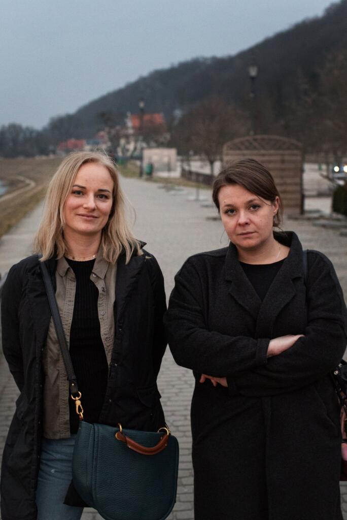 Joanna Stefańska, left, and Weronika Ziarnicka stand on the boardwalk of Kazimierz Dolny near the Vistula River on Wednesday. The women have raised concerns about Spokane pastor Matt Shea, who is staying in the town with 62 Ukrainian orphans. “He just lies all the time,” said Ziarnicka of Shea.
