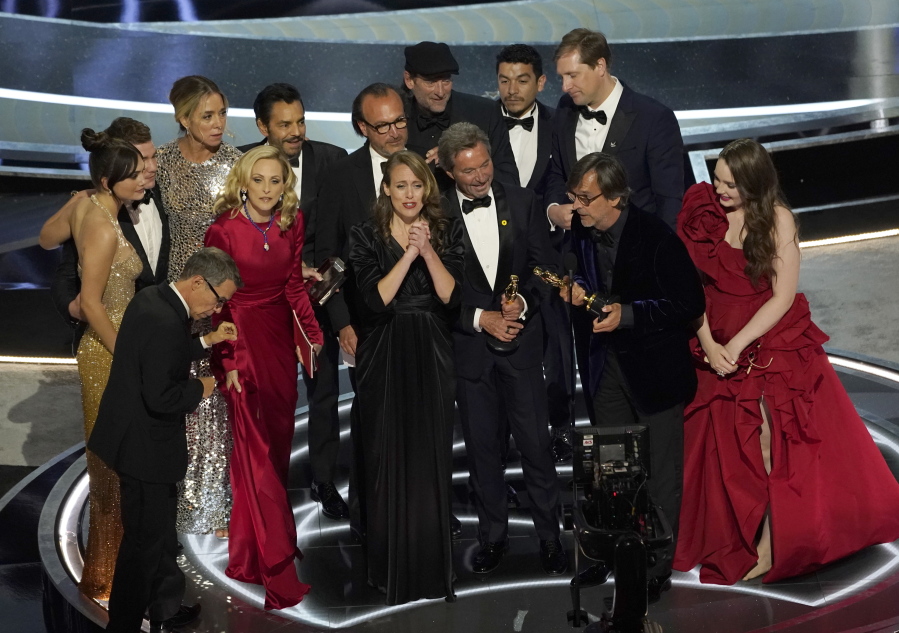 The cast and crew of "CODA" accept the award for best picture at the Oscars on Sunday, March 27, 2022, at the Dolby Theatre in Los Angeles.