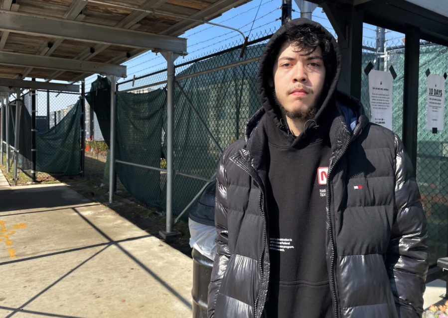 Elijah Ramos stands outside the the Amazon fulfillment center in Staten Island borough of New York at a bus stop on March 16, 2022. An independent group formed by former and current Amazon workers are trying to unionize a company warehouse in New York City. If successful, the effort at the Amazon fulfillment center in Staten Island could lead to the first unionized Amazon facility in the U.S.